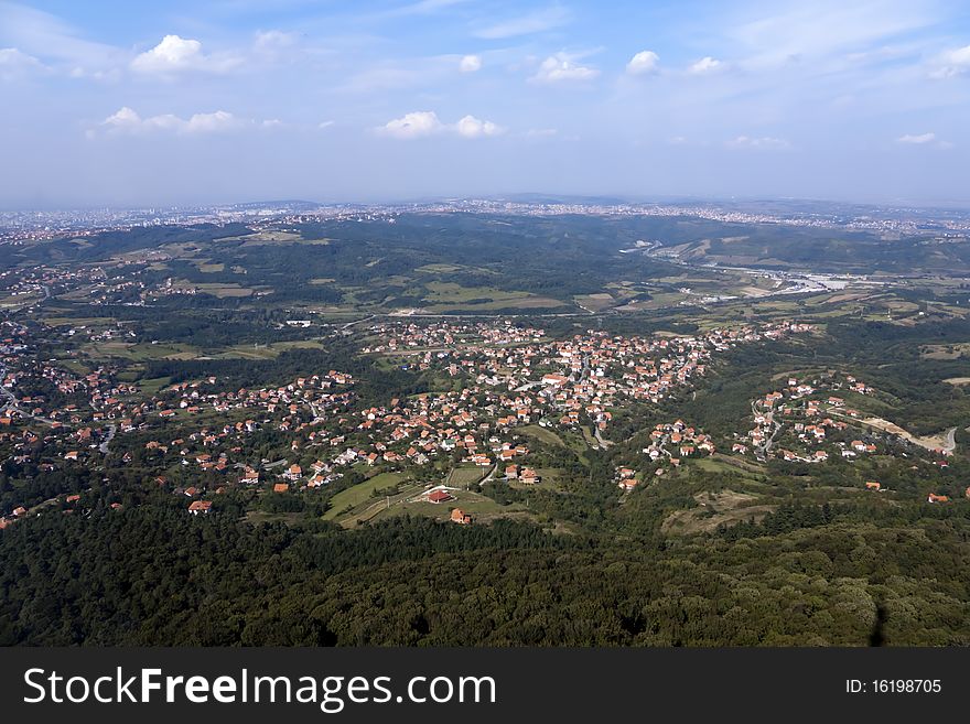 A Panoramic shot of old  town Belgrade and Forest in the Foreground.