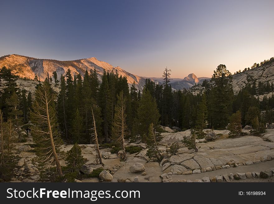 The vast beauty of the Yosemite mountains at sunset in the Yosemite National Park in California. The vast beauty of the Yosemite mountains at sunset in the Yosemite National Park in California