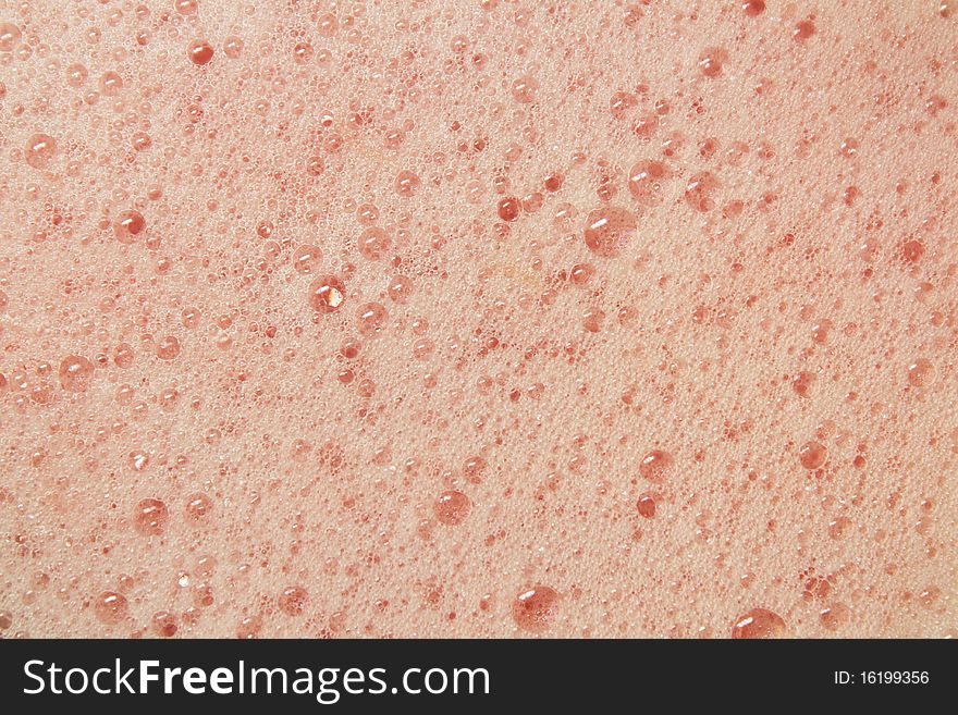 Close up of grapefruit juice bubbles fresh out of a blender.