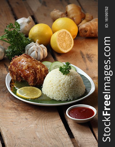 Deep fried chicken rice with ingredient background. Deep fried chicken rice with ingredient background