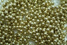 Celebratory Brilliant Beads Of Golden Color Royalty Free Stock Photography Celebratory Brilliant Beads Of Golden Color Royalty Free Stock Photography