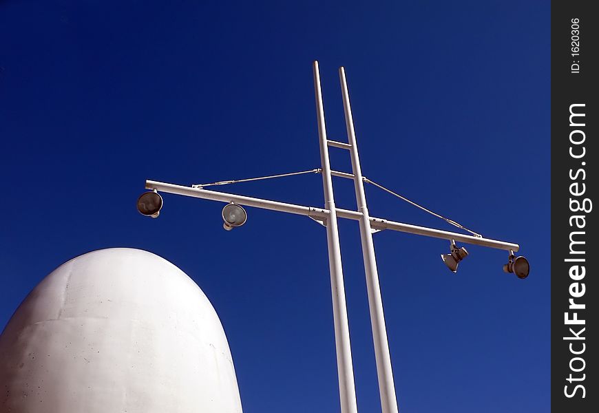 Abstract modern harbor architectural elements: lamp mast and marine ship power pipe. Abstract modern harbor architectural elements: lamp mast and marine ship power pipe