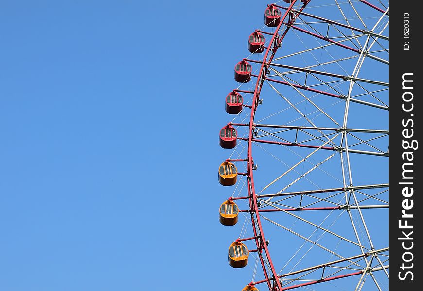 Big wheel cabins on the clear blue sky background. Big wheel cabins on the clear blue sky background