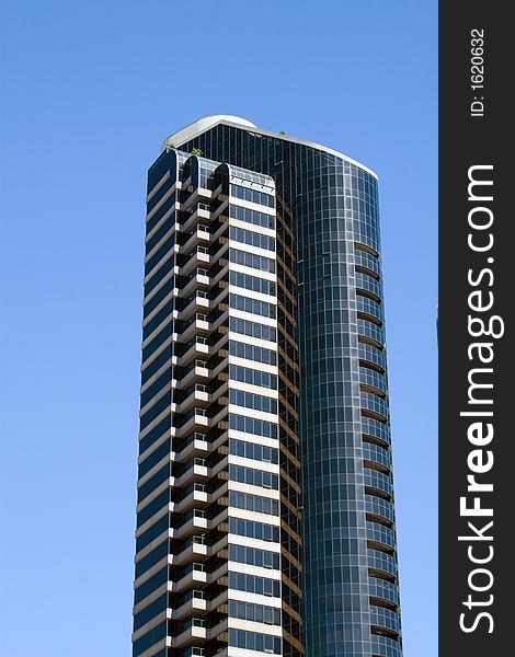 Modern skyscrapers against a bright blue sky