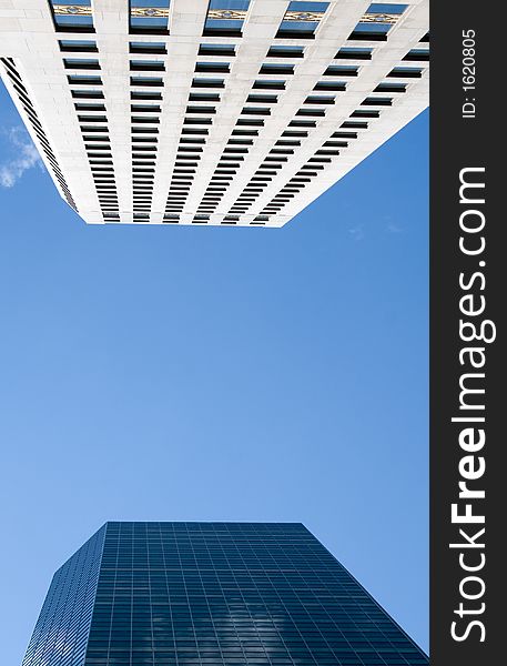 Blue sky reflected in a glass office building. Blue sky reflected in a glass office building