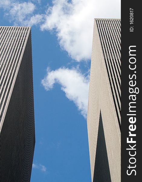 Modern skyscrapers against a bright blue sky