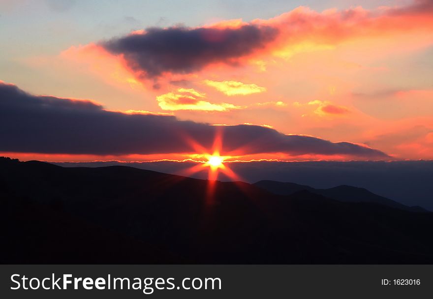 Red sun and clouds on sunset