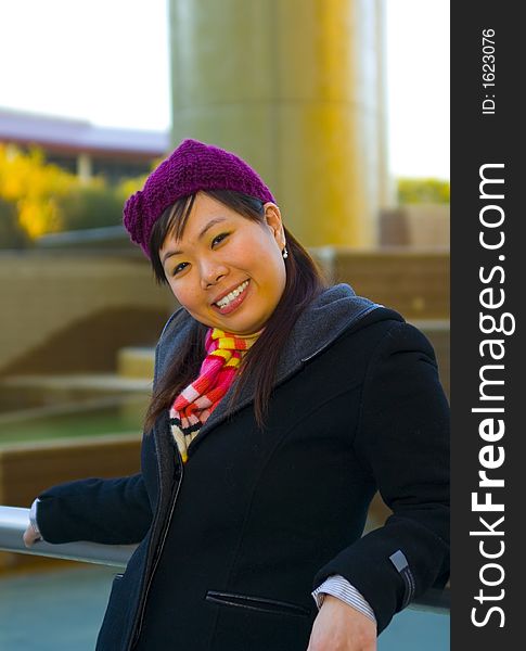 Happy young asian girl in winter clothes