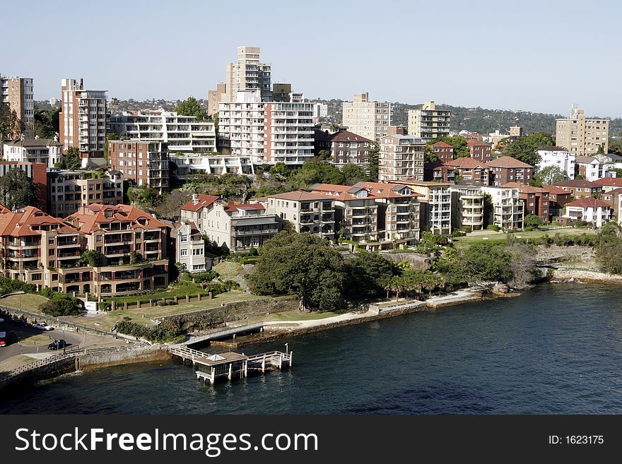 Buildings At The Sydney Harbour Coastline On A Summer Day, Australia. Buildings At The Sydney Harbour Coastline On A Summer Day, Australia