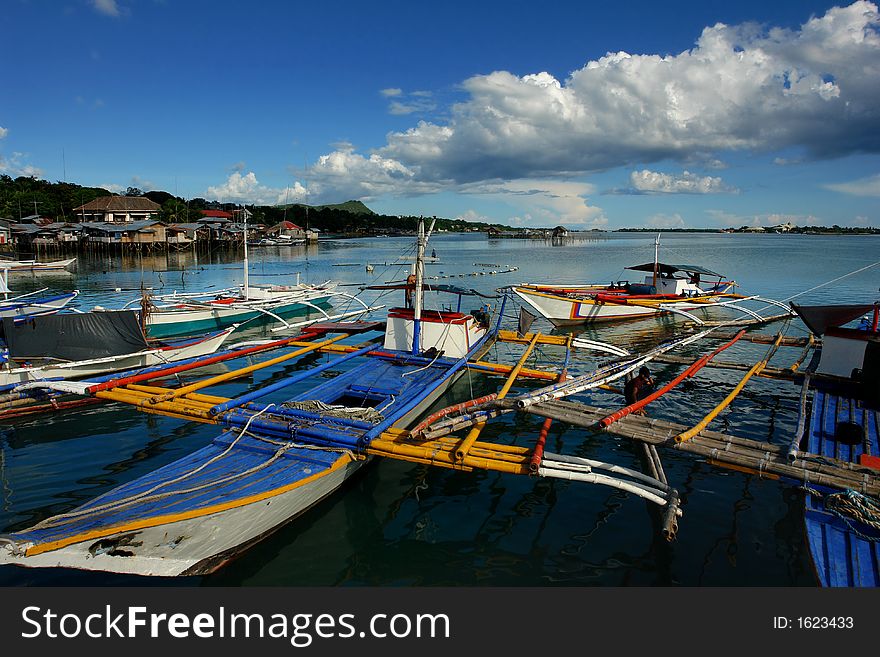 Asian village port with fishermen's boats.