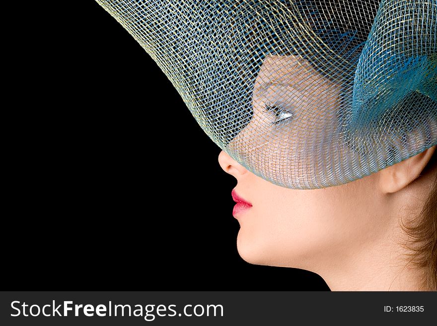 Profile of woman with stylish grid as a hat. Profile of woman with stylish grid as a hat