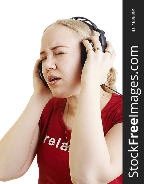 Isolated young woman listening music on earphones and sining along
