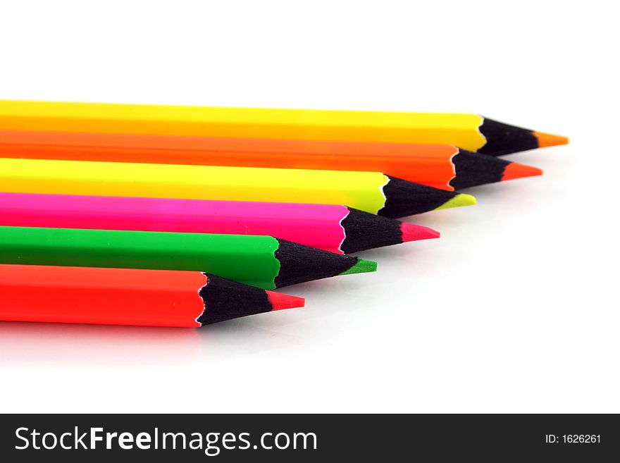 Neon Pencils in a line on a white background. Neon Pencils in a line on a white background