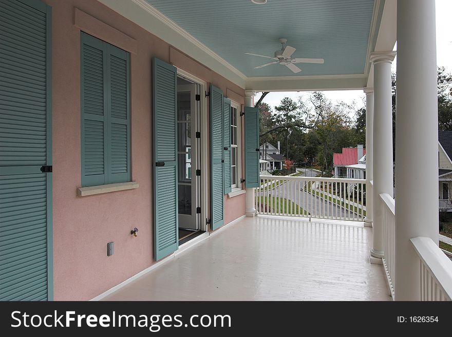 Upstairs porch of new house with hurricane shutters