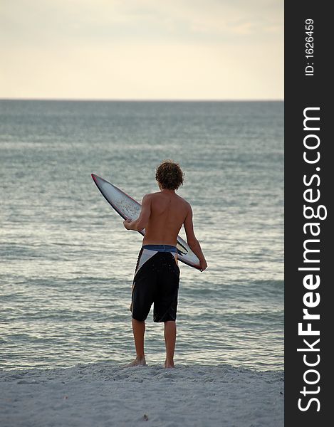 Boy surfer on Florida beach