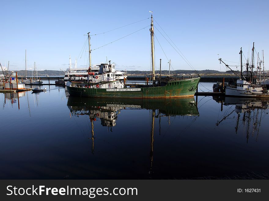 Green Sea Vessel Docked in harbor. Green Sea Vessel Docked in harbor