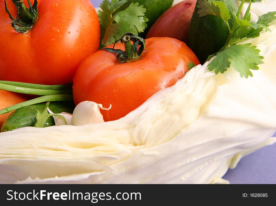 Ingredients for salad on a light blue background. Ingredients for salad on a light blue background.