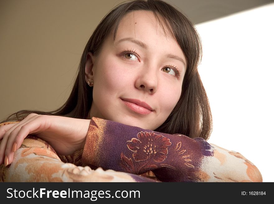 Young brunette dreaming closeup portrait with space for text. Young brunette dreaming closeup portrait with space for text