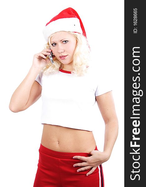 Beautiful woman  in a santa's cap cell phone. Isolated on white background. Beautiful woman  in a santa's cap cell phone. Isolated on white background