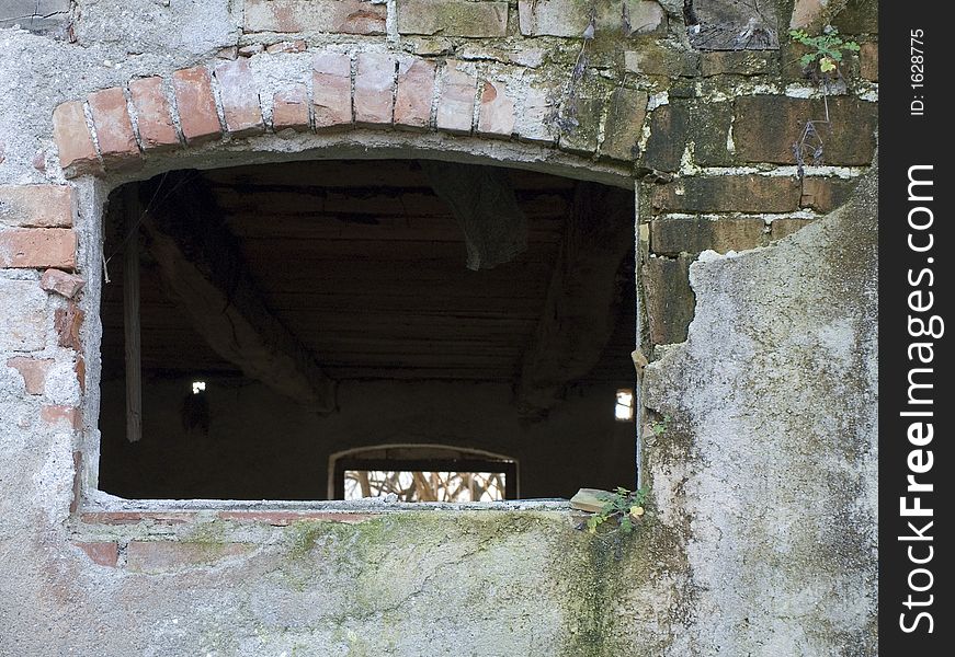 Old empty window on the very old stone wall. Old empty window on the very old stone wall