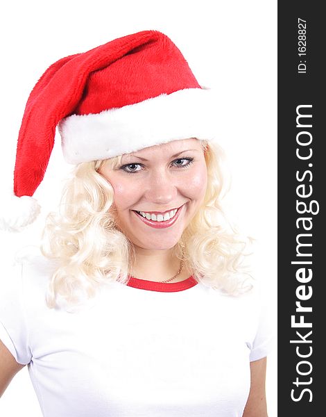 Young beautiful woman in a santa's cap smiling. Isolated on white. Young beautiful woman in a santa's cap smiling. Isolated on white.