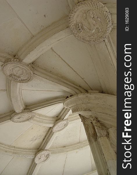 A typical renaissance stairway spiral with cartouches in a French Loire valley castle. A typical renaissance stairway spiral with cartouches in a French Loire valley castle