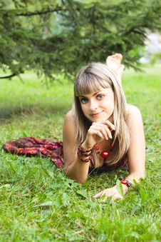 Girl Lying On The Grass And Smiling Stock Photography