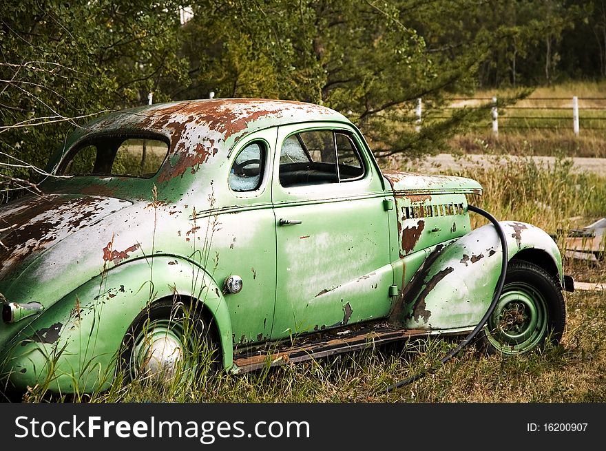 Broken down vintage car on the side of the road. Broken down vintage car on the side of the road.