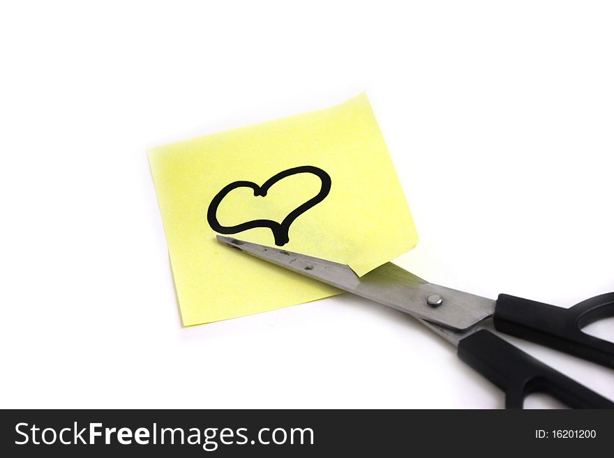 We see the scissors cutting note with heart on white background