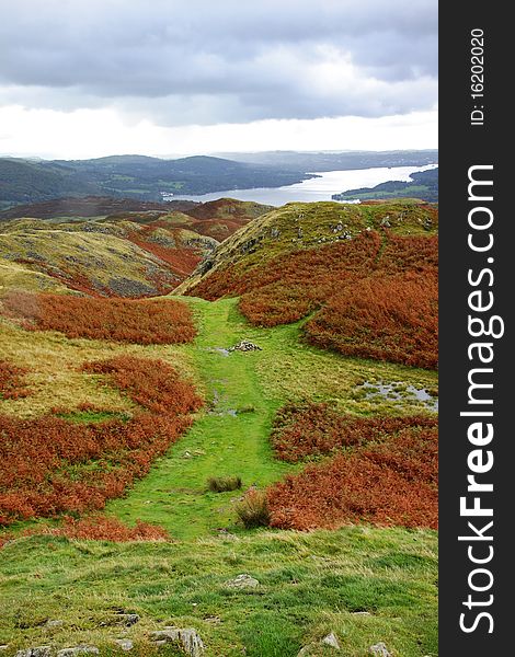 A Lake Windermere in Cunbria viewed from a Mountain top in early Autrumn. A Lake Windermere in Cunbria viewed from a Mountain top in early Autrumn