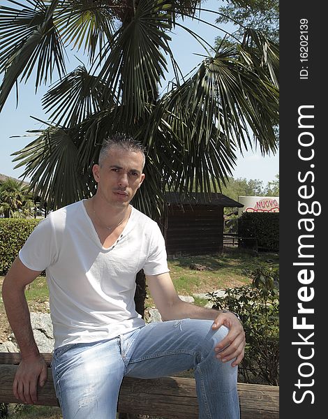 Man in white shirt and jeans
