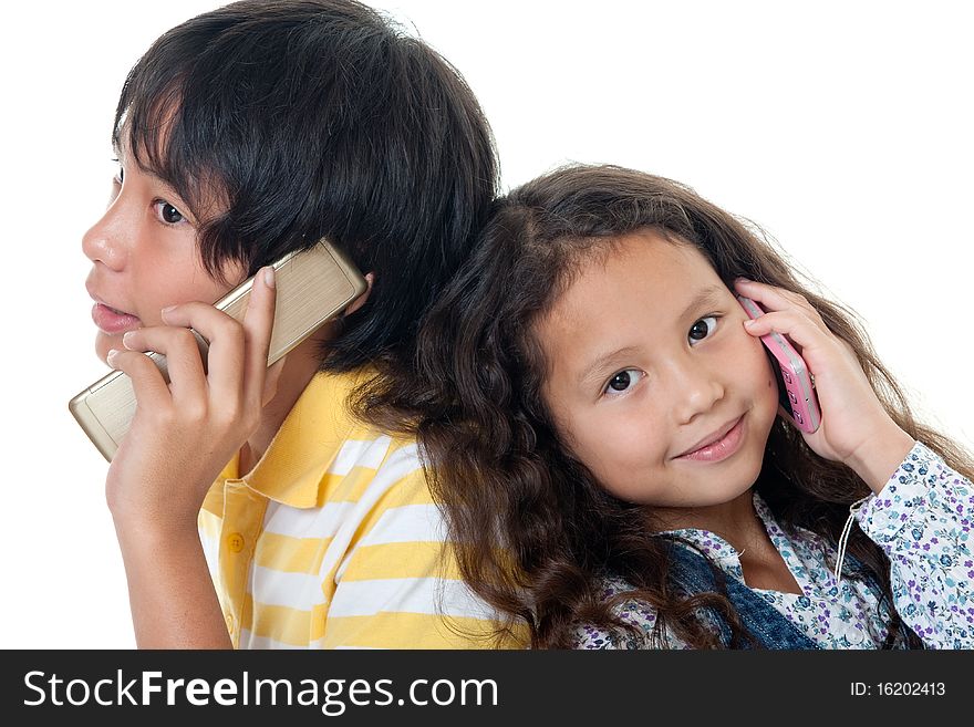 Cellphone, portrait of two children talkind with mobilephone against white background