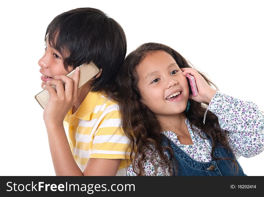 Cellphone, portrait of two children talkind with mobilephone against white background