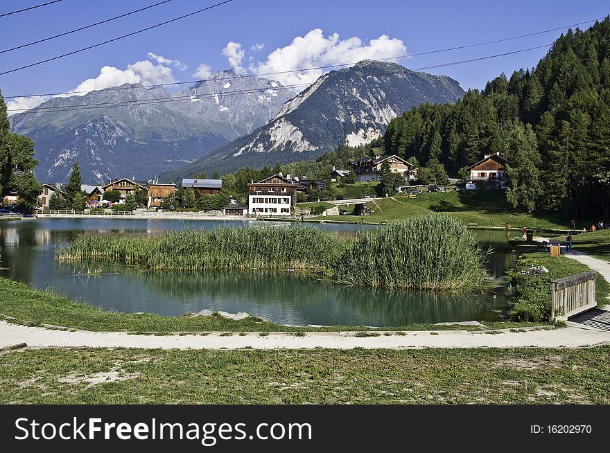 This image shows the lake of Le Praz,  with reeds. This image shows the lake of Le Praz,  with reeds