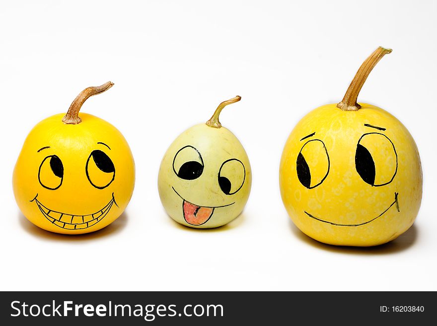 Decorative pumpkins with faces drawn on them. Decorative pumpkins with faces drawn on them