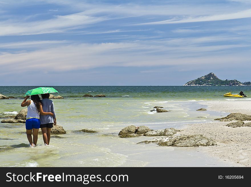 Walking plays of Thai couple woman , on Huahin beach , Thailand ,. Walking plays of Thai couple woman , on Huahin beach , Thailand ,