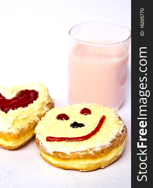 The bread smiles with milk on white background ,. The bread smiles with milk on white background ,