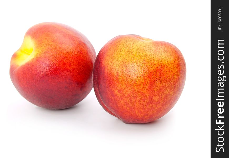 Ripe peach on a white background