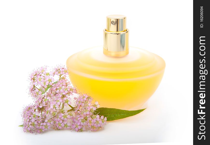 Yellow beautiful bottle of perfume with flowers