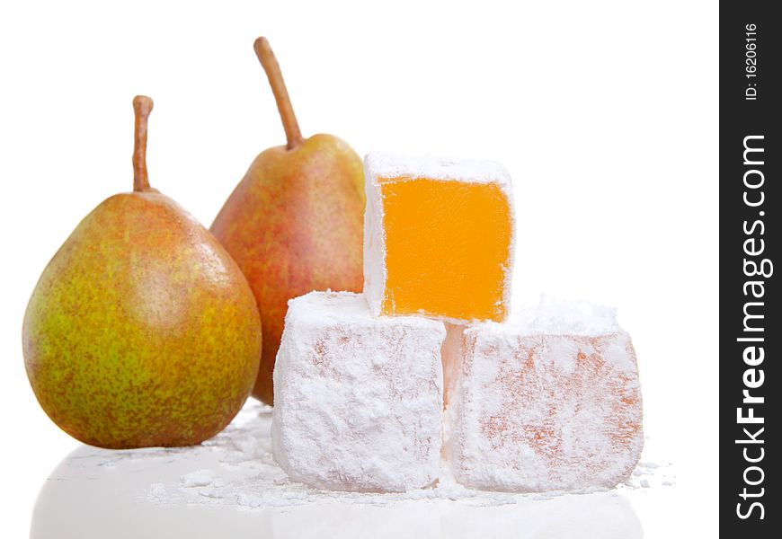 Isolated close up of a stack of turkish delight with two pear