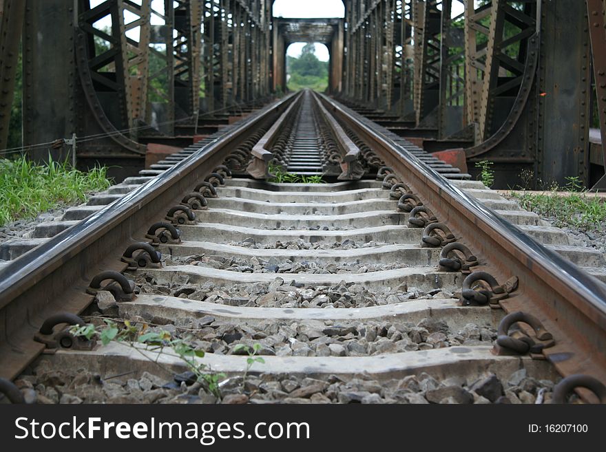 Black brige made by  iron and painted whith black colour. it is train bridge  above  river  in sisaket  thailand. Black brige made by  iron and painted whith black colour. it is train bridge  above  river  in sisaket  thailand.