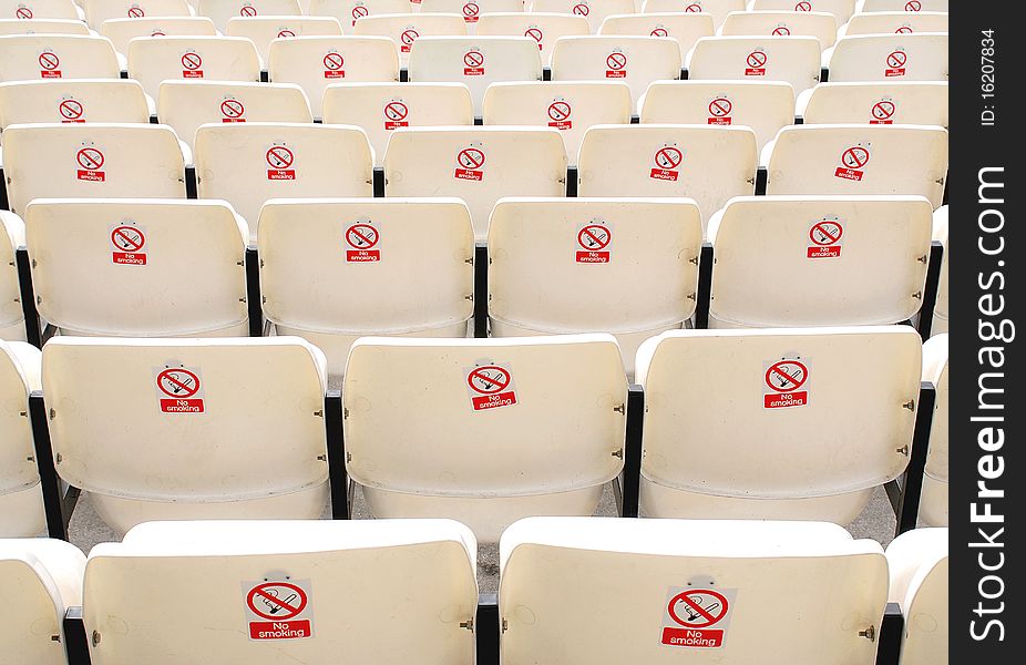 Rows of seats with no smoking signs on their backs