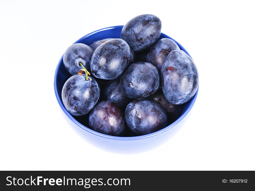 dark blue plums in the bowl