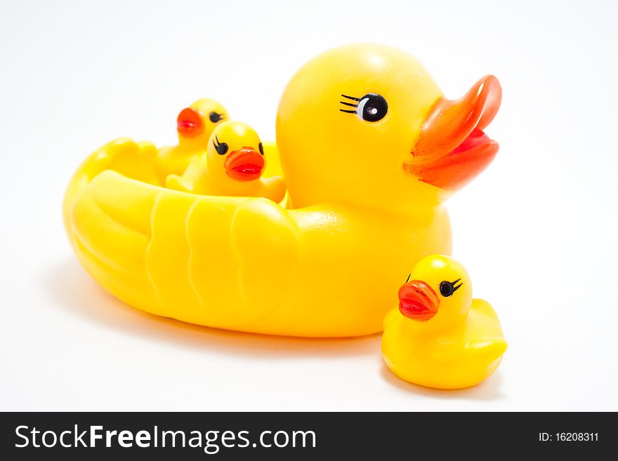 Plastic yellow duck toy on white background