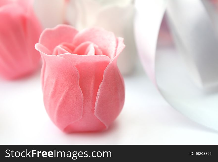 Rose flower pink made of soap on white (macro)