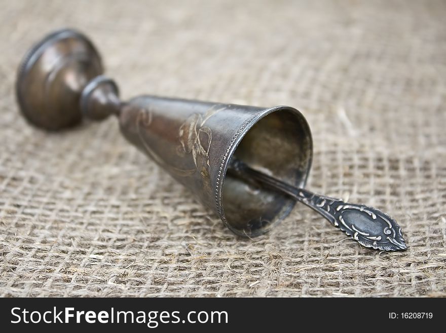 Silver goblet with silver spoon