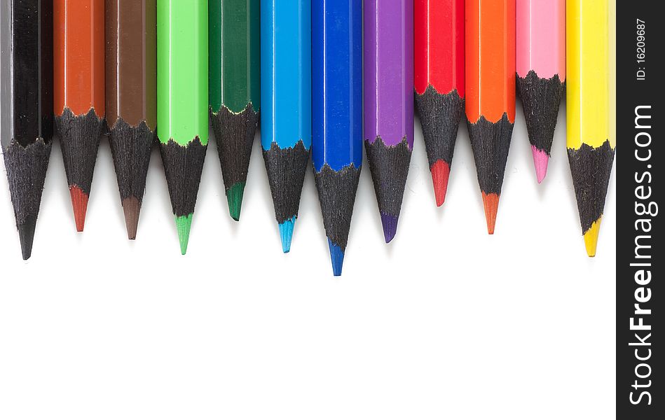 Colored pencils isolated over white background