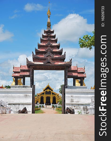 Arched entrance of buddhist temple with brighten sky