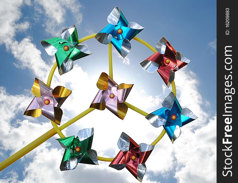 Pinwheel in front of sky and clouds. Pinwheel in front of sky and clouds