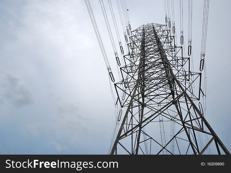 Electric high voltage post with the sky background